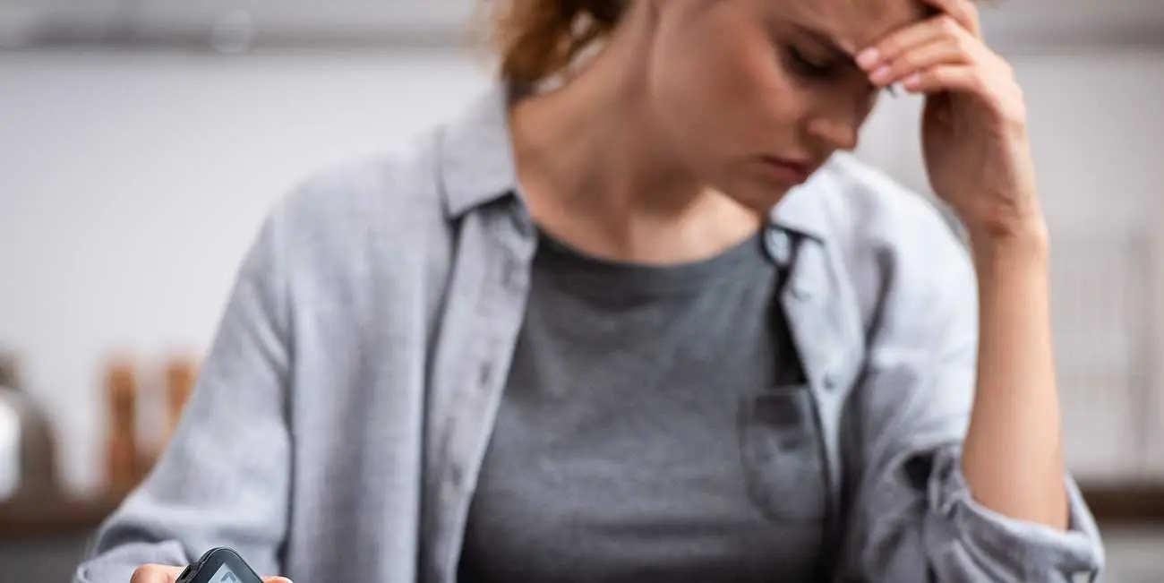 Woman suffering from an episode of hypoglycemia - diabetes symptom
