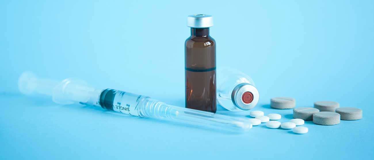 Syringe, vial and tablets