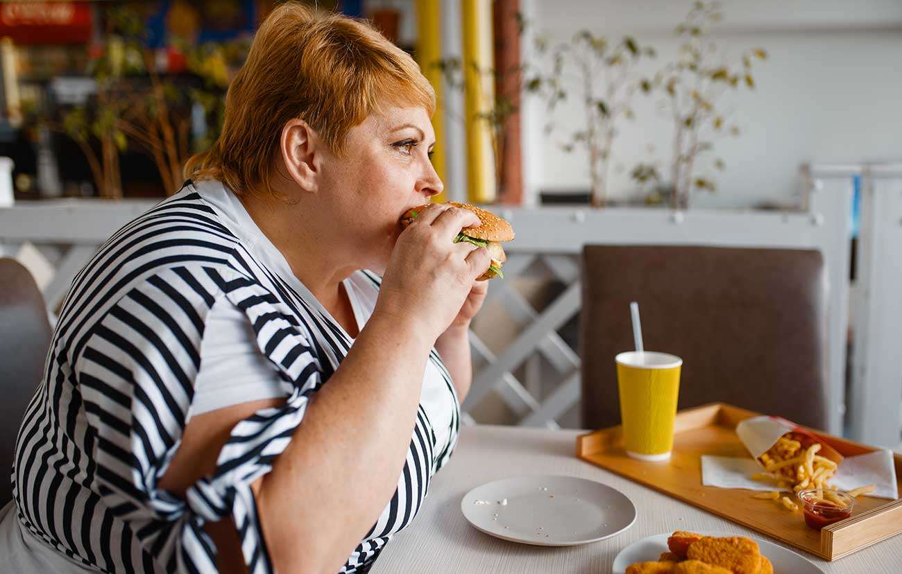 Woman eating a hamburger